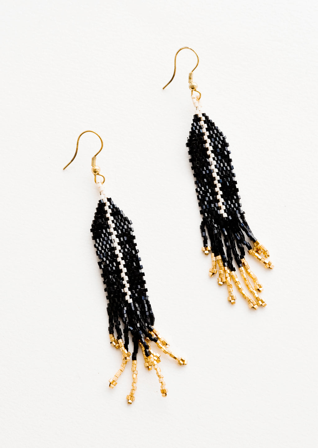 Black: Dangling beaded earrings with black beads accented with gold bead stripe and gold bead fringe.