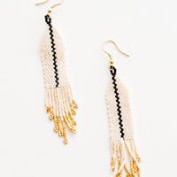 Ivory: Dangling beaded earrings with white beads accented with black bead stripe and gold bead fringe.