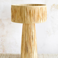 Natural: A table lamp wrapped in natural raffia.