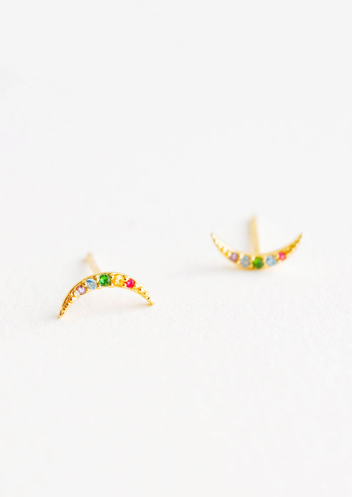 1: Moon-shaped stud earrings featuring inset multicolored crystals.