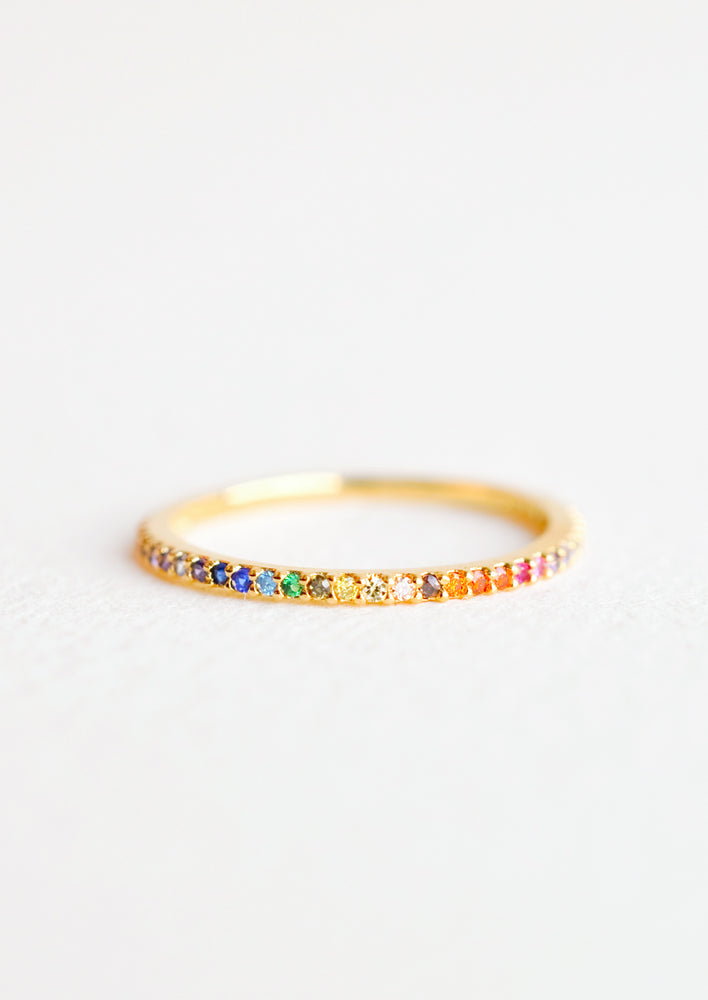 Gold band ring with rainbow gradient rhinestones all the way around