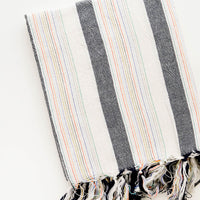 1: Cotton Turkish Towel in Natural & Charcoal with Rainbow Colored Stitching and Fringed Tassel Trim
