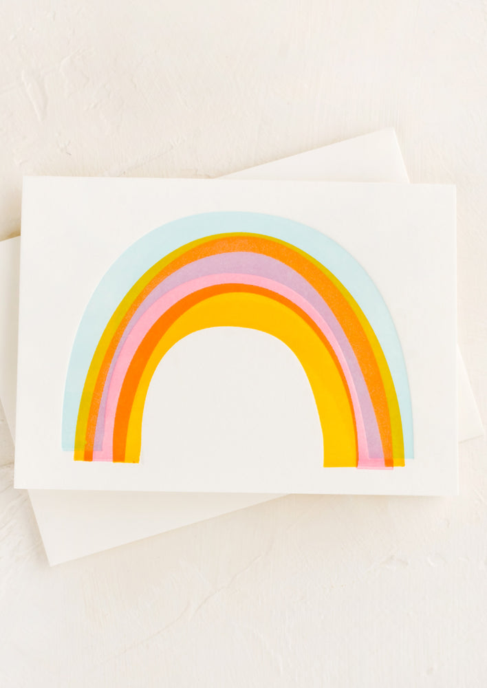 A greeting card with rainbow on front.