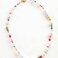 1: Beaded necklace with a mix of chunky freshwater pearls and rainbow-hued seed beads