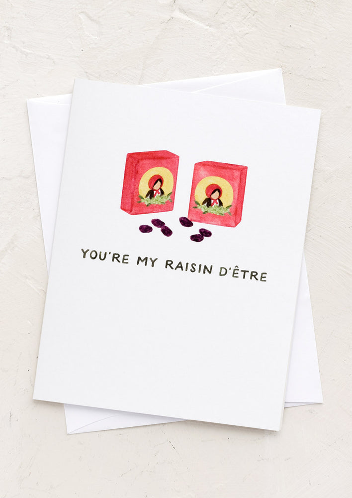 A greeting card with raisin box illustration and text reading "You're My Raisin D'Etre".