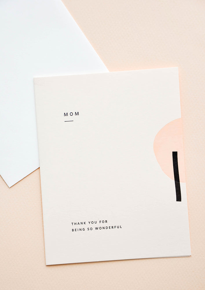 A greeting card with geometric design and mother's day messaging.