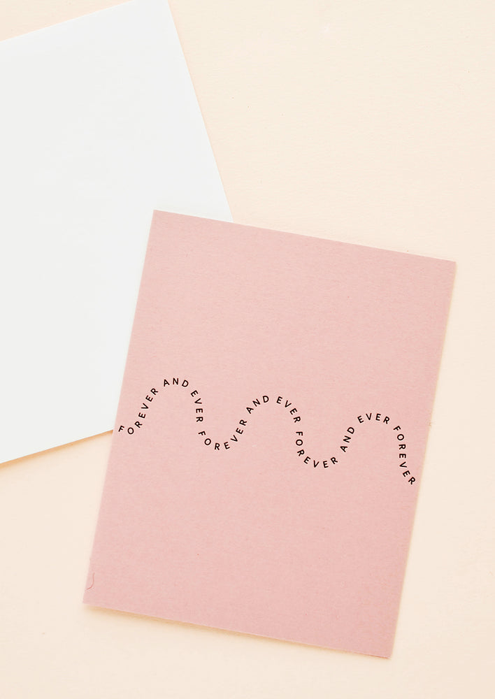 1: Rose pink greeting card with printed text in a wave-like formation, repeating the words "Forever and ever"
