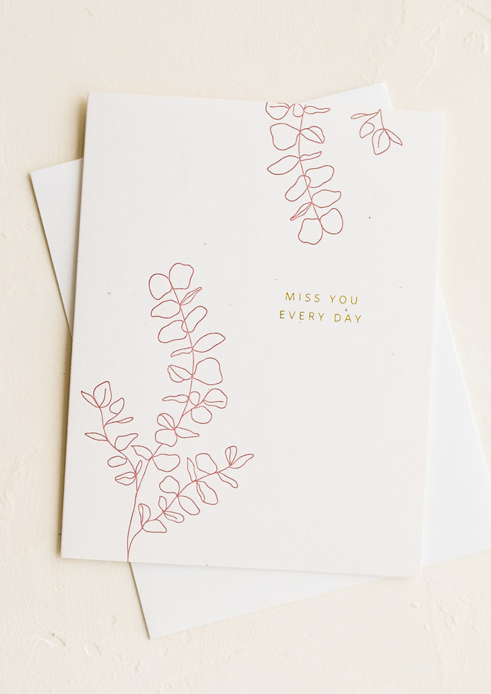 1: A greeting card with gold lettering reading "Miss You Every Day"