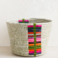 Chroma Multi: A round planter basket with colorful panel at front.