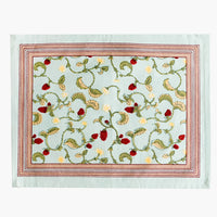 2: A light aqua placemat with bordered raspberry print.