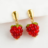 1: A pair of glass earrings in shape of raspberries.