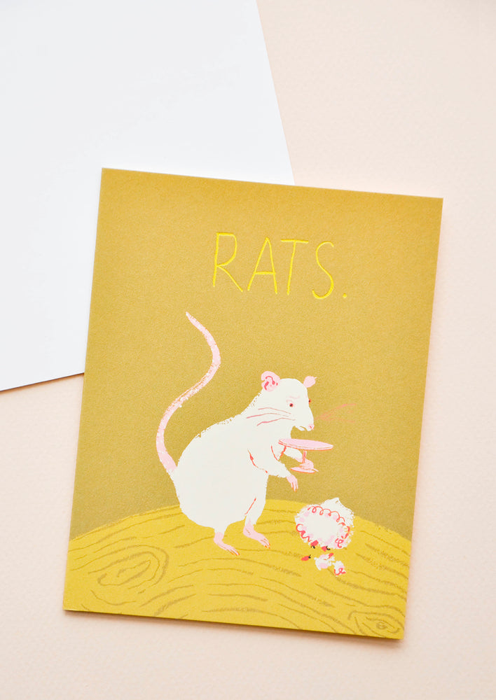 1: Yellow notecard with drawing of a rat and the text "Rats" with white envelope.