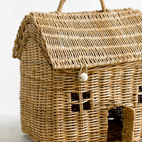 2: A rattan storage basket in the shape of a house.