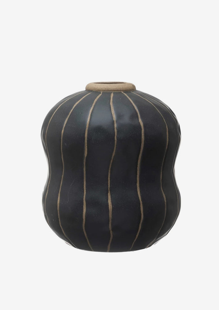 2: A black vase with thin tan vertical stripes.