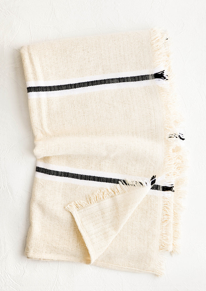 1: Raw cotton blanket in natural color with black and white stripes and fringed edge