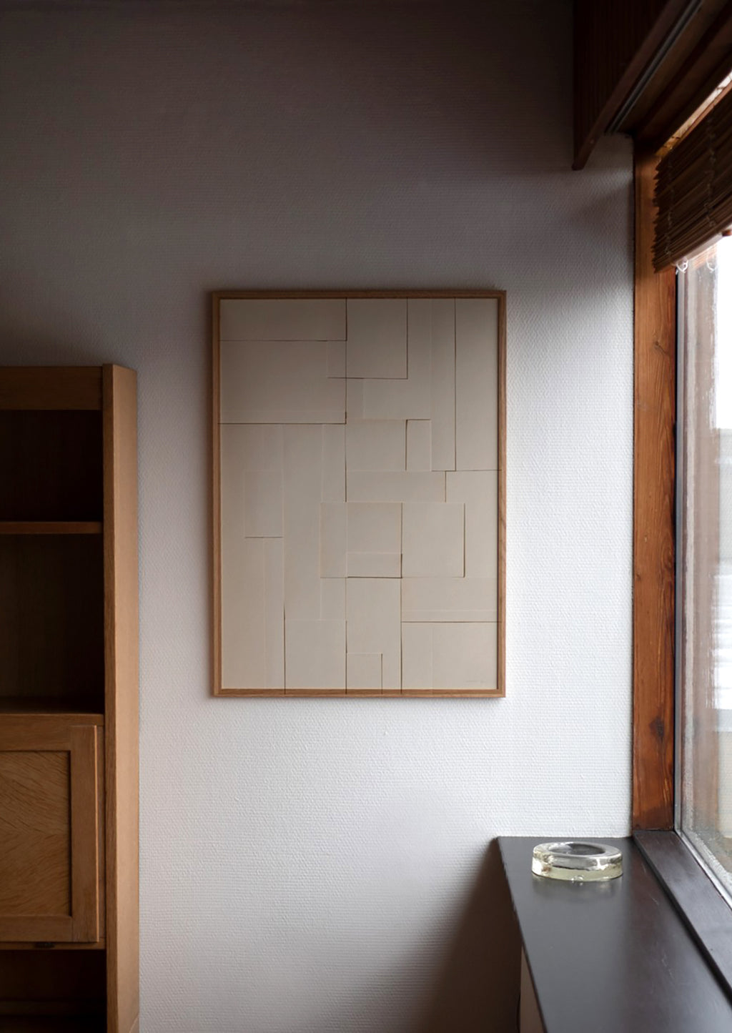2: An art print featuring a photograph of layered neutral pieces of paper cut in squares and rectangles.