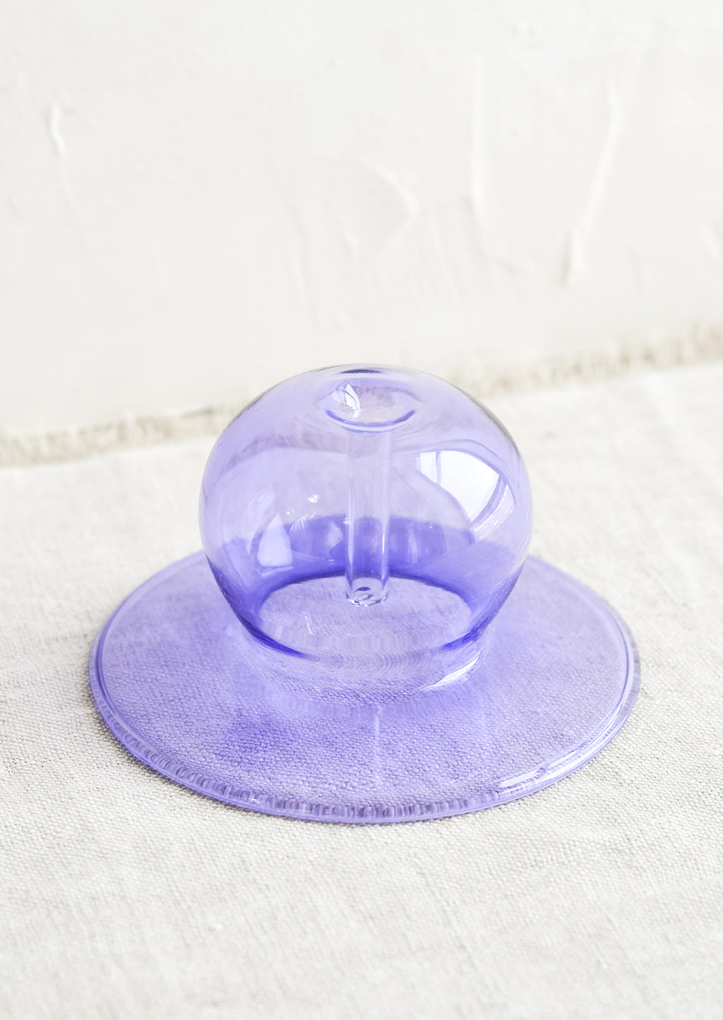 Lavender: A purple bubble shaped glass form designed to hold stick incense.