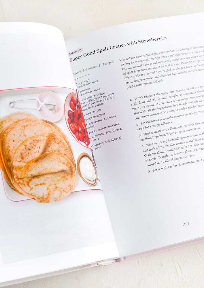 3: A cookbook open to recipe for spelt crepes with strawberries.