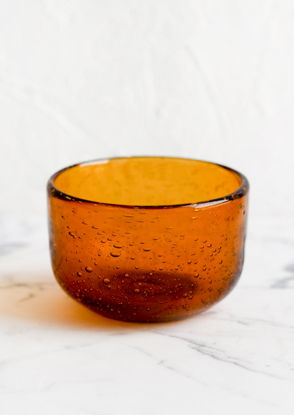 Amber: A small recycled glass bowl in clear amber color.