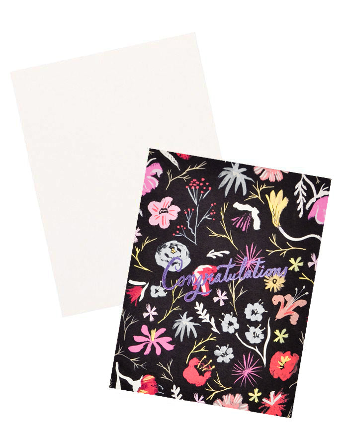 3: Notecard with colorful floral decoration on black background, and the text Congratulations in metallic pink script, with white envelope.