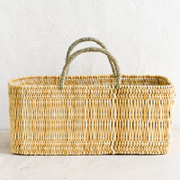 1: A rectangular storage basket made from natural reeds.