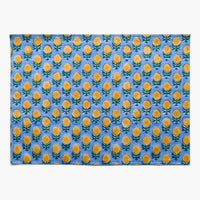 Blue / Yellow Multi: A blue and yellow floral block print placemat.