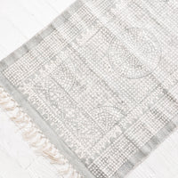 1: Flatweave rug with contrasting oriental pattern and fringe trimmed edges on two sides