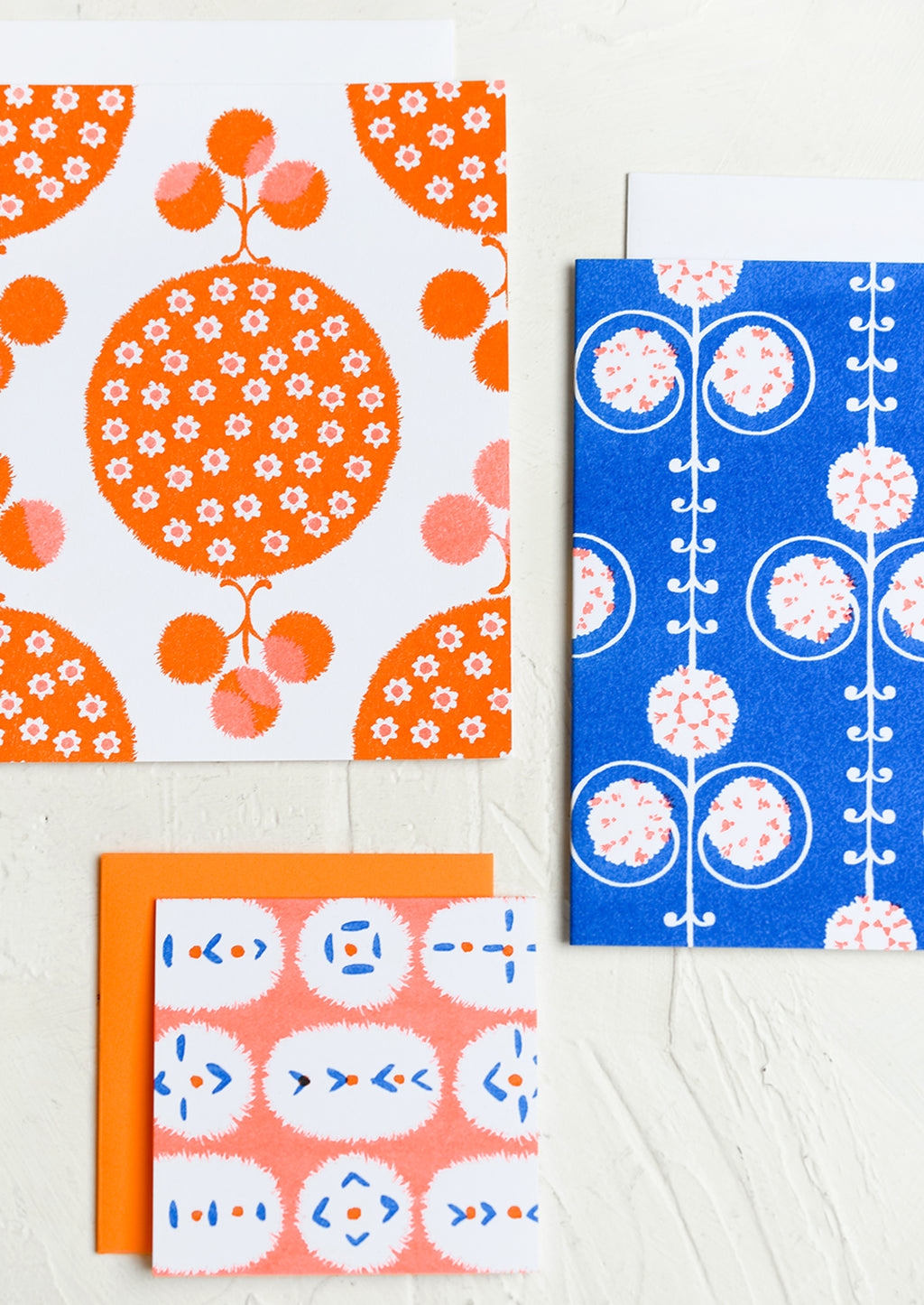 6: A patterned risograph printed card set in cobalt and orange.
