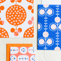 6: A patterned risograph printed card set in cobalt and orange.
