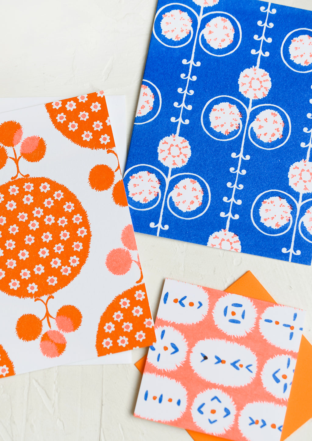 Neon Orange / Cobalt: A patterned risograph printed card set in cobalt and orange.
