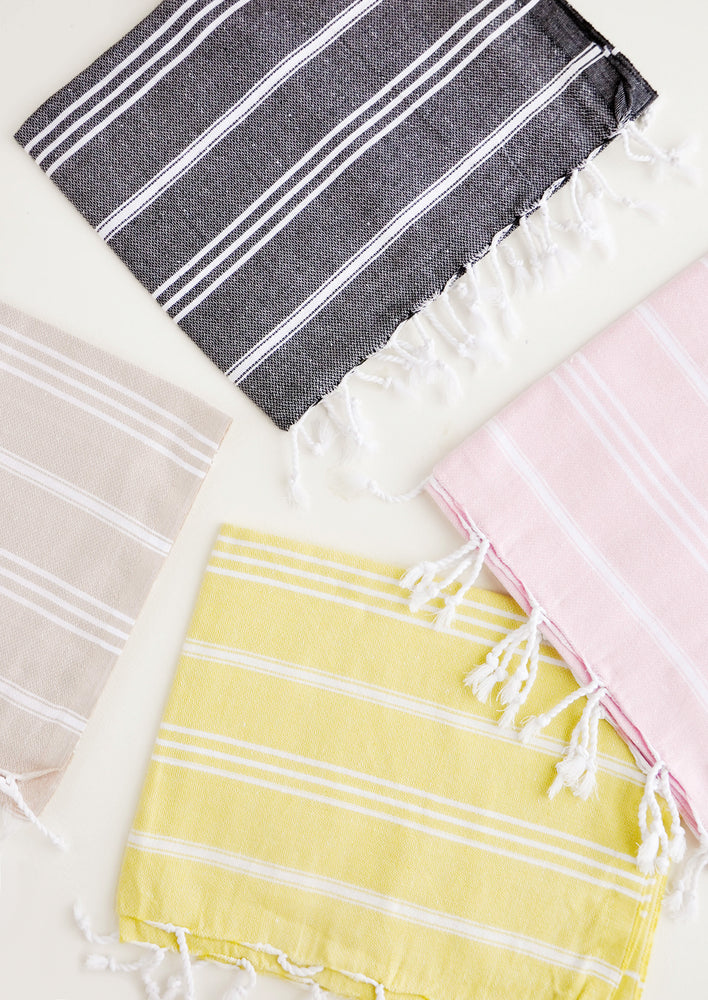 Colorful towels with white stripes in a variety of colors