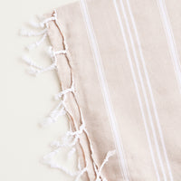 Tan / Hand Towel: Cotton towel with white stripes in tan, twisted fringe on ends