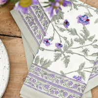 2: A pair of block printed cotton napkins in green and purple floral print.
