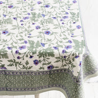 2: A block printed floral tablecloth in purple and green floral.