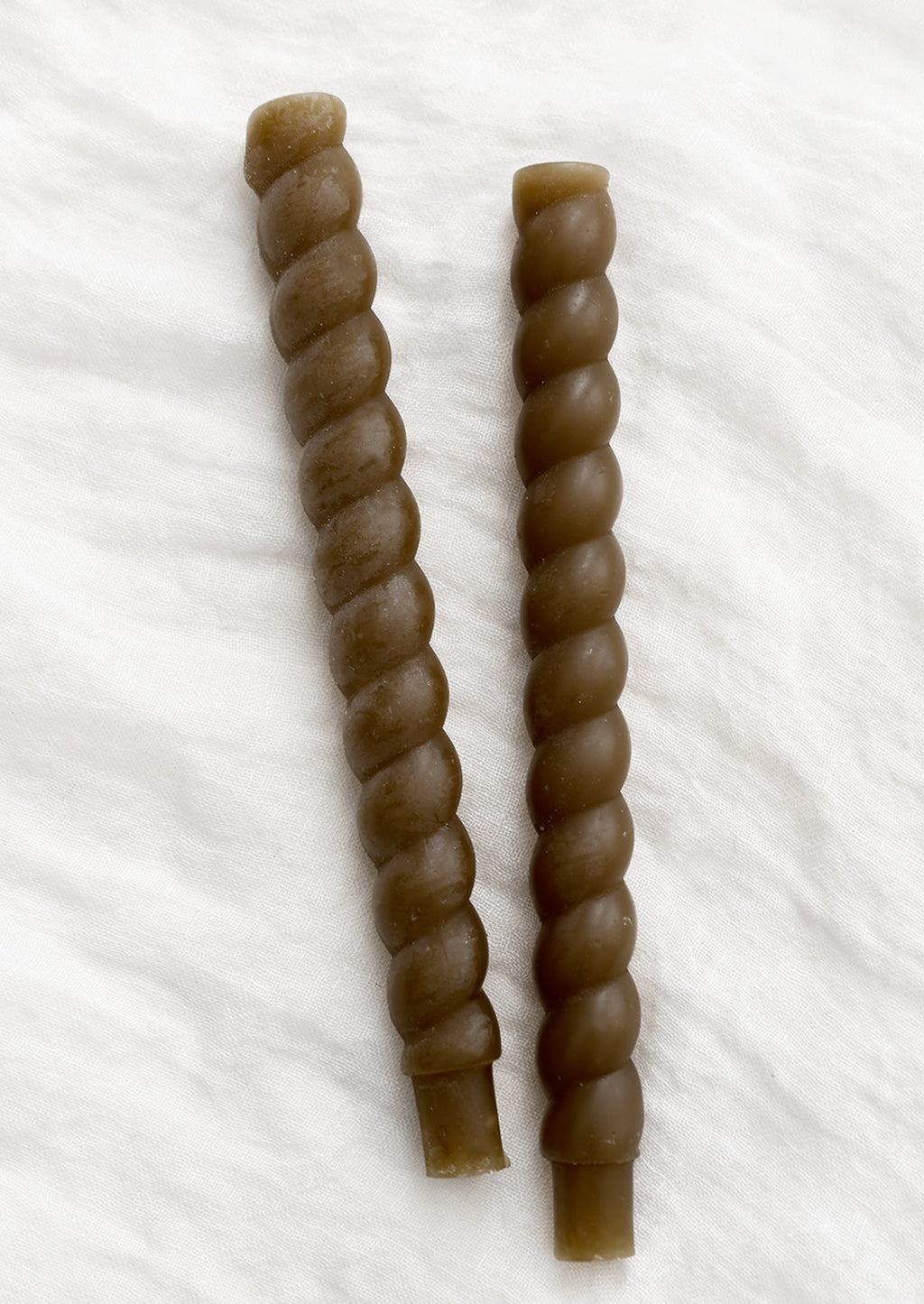 Truffle: Two twisted taper candles in truffle brown.