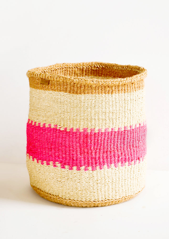 Woven sisal basket in tan stripes with neon pink middle stripe