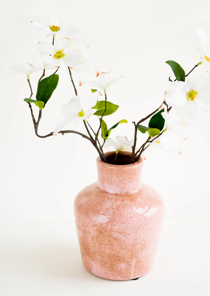 Distressed pink ceramic vase with dogwood flowers