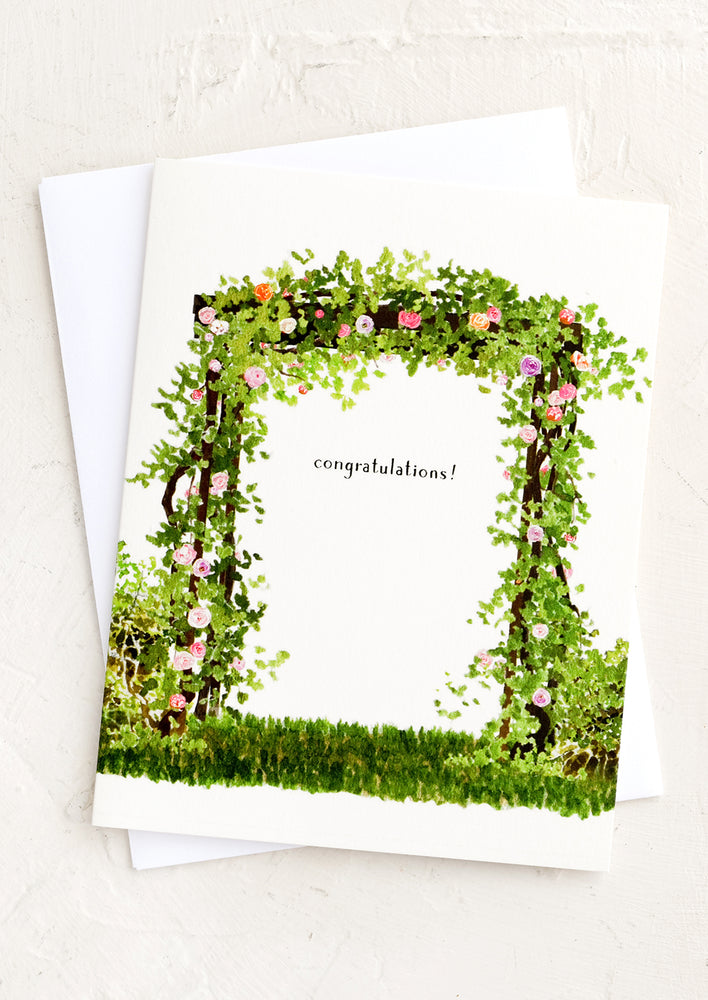 1: A greeting card with illustration of arbor reading "Congratulations!".