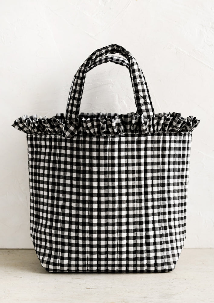 A quilted tote bag in black and white gingham.