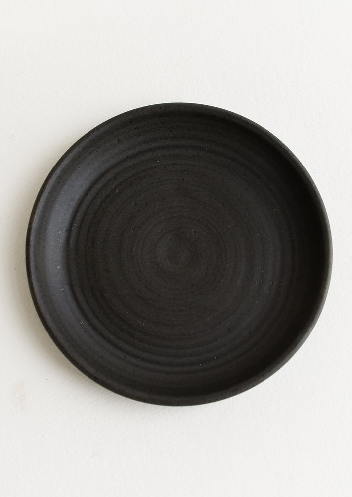 Meteor Black / Dessert Plate: A ceramic side plate in a matte black glaze.
