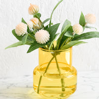 Medium / Saffron Yellow: A small yellow glass vase with gomphrena flowers.