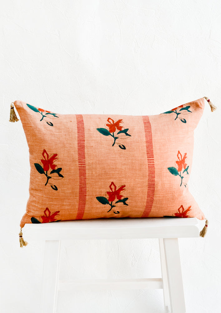 Block printed lumbar pillow in clay brown fabric with red flowers