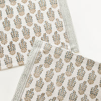 Mint Multi: Two ivory rectangular cotton placemats with green floral pattern.