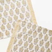 Mustard Multi: Two ivory rectangular cotton placemats with yellow floral pattern.