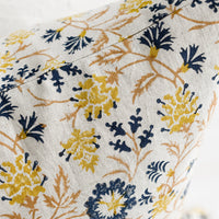 2: A block printed pillow in navy, brown and yellow floral print on natural linen.