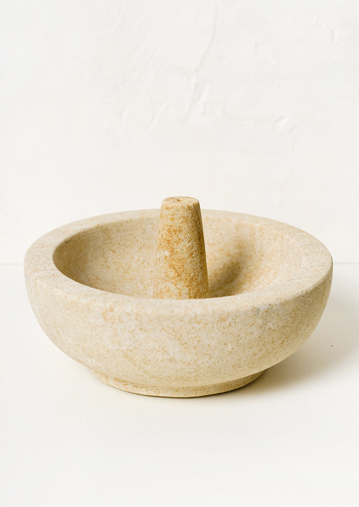 A sandstone incense burner with bowl for stick incense.