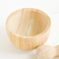 2: Large mortar and pestle with both pieces made from variegated tan-colored sandstone