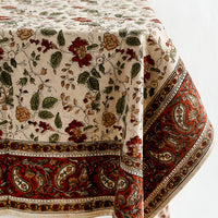 1: A block printed tablecloth in floral and paisley print.