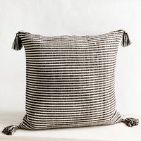 Dark Brown: Large square throw pillow in textured dark brown and cream stripes, decorative tassel at each corner