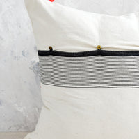 3: A throw pillow with button back closure.